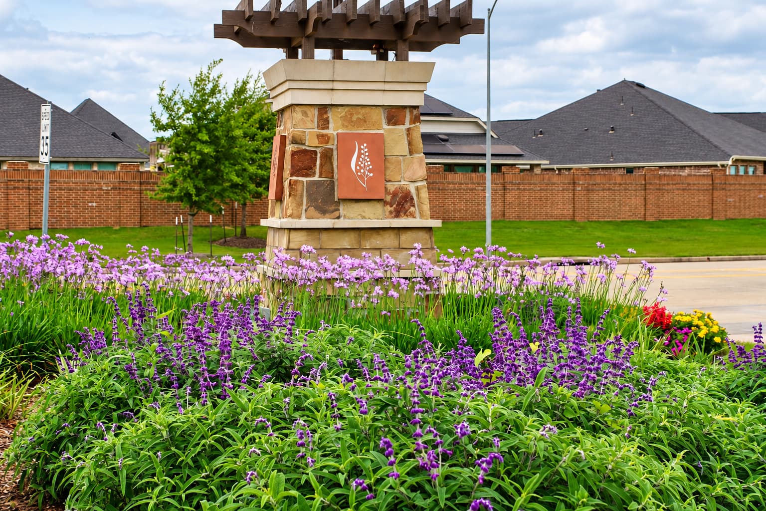 Client-supplied photograph of landscaped planting beds at Dellrose.